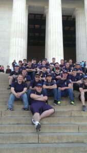 People posing in front of the Lincoln Memorial